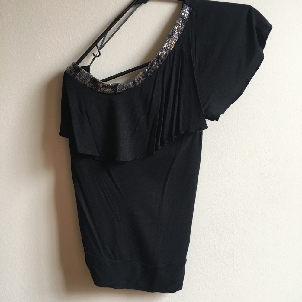 One shoulder black and sequins top.